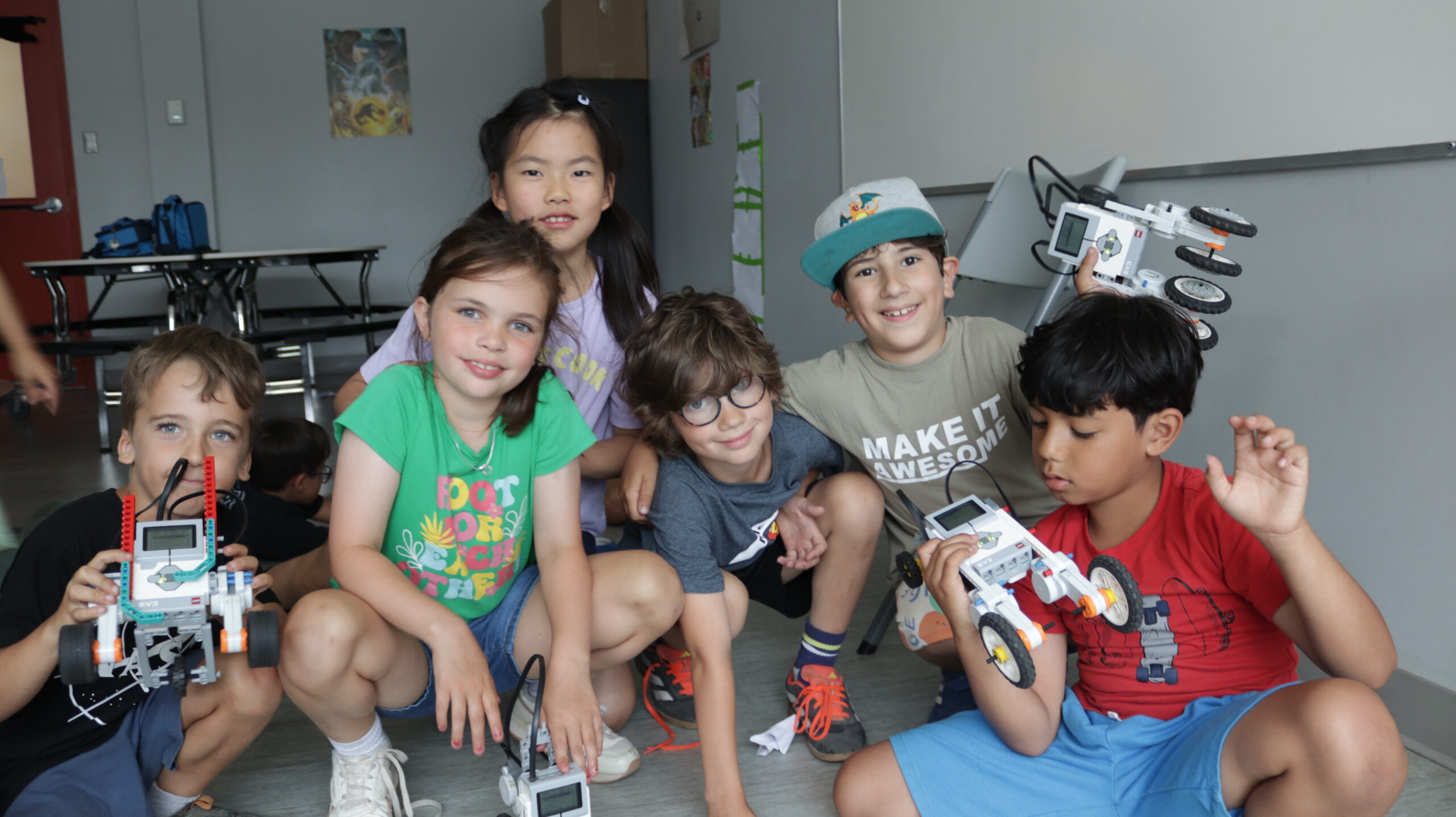 Robotics Camp Activity at Explorations Camp - Child Coding a Robot at Camp